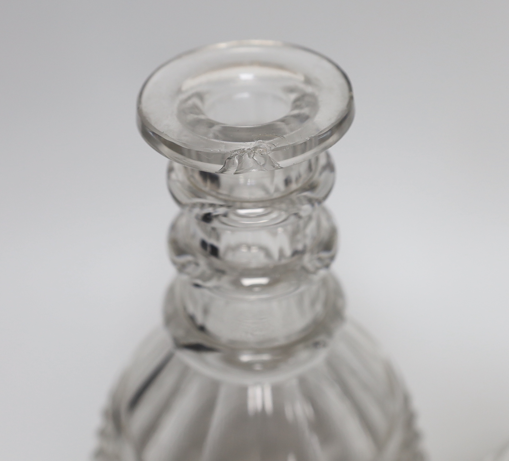Three William IV cut glass decanters, all in a similar design with three neck rings and two with flattened stoppers, highest 28cm (3)